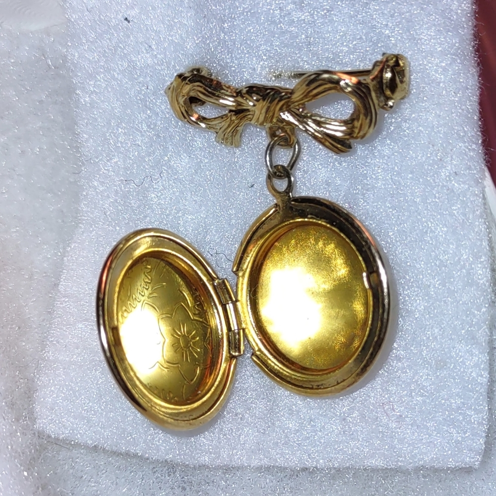 Bow Brooch with Dangling Round Gold Floral Locket